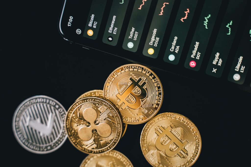 bitcoins beside a phone